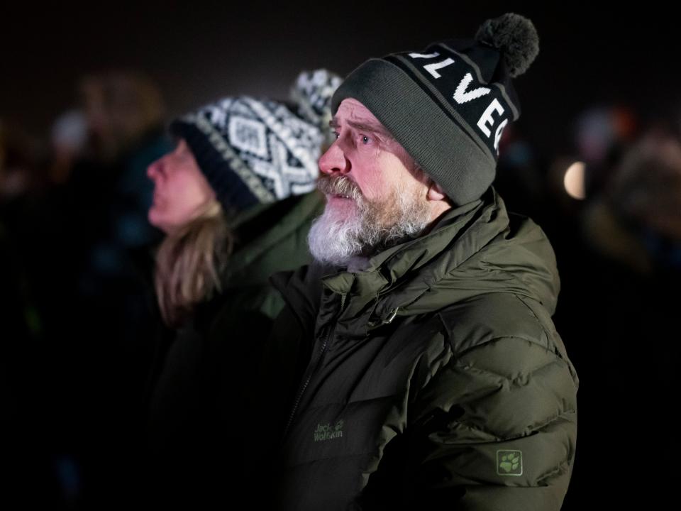 Spectators watch on a big screen at Cornwall Airport Newquay as the LauncherOne rocket is launched from Cosmic Girl, a Boeing 747-400, on January 9, 2023 in Newquay, United Kingdom.
