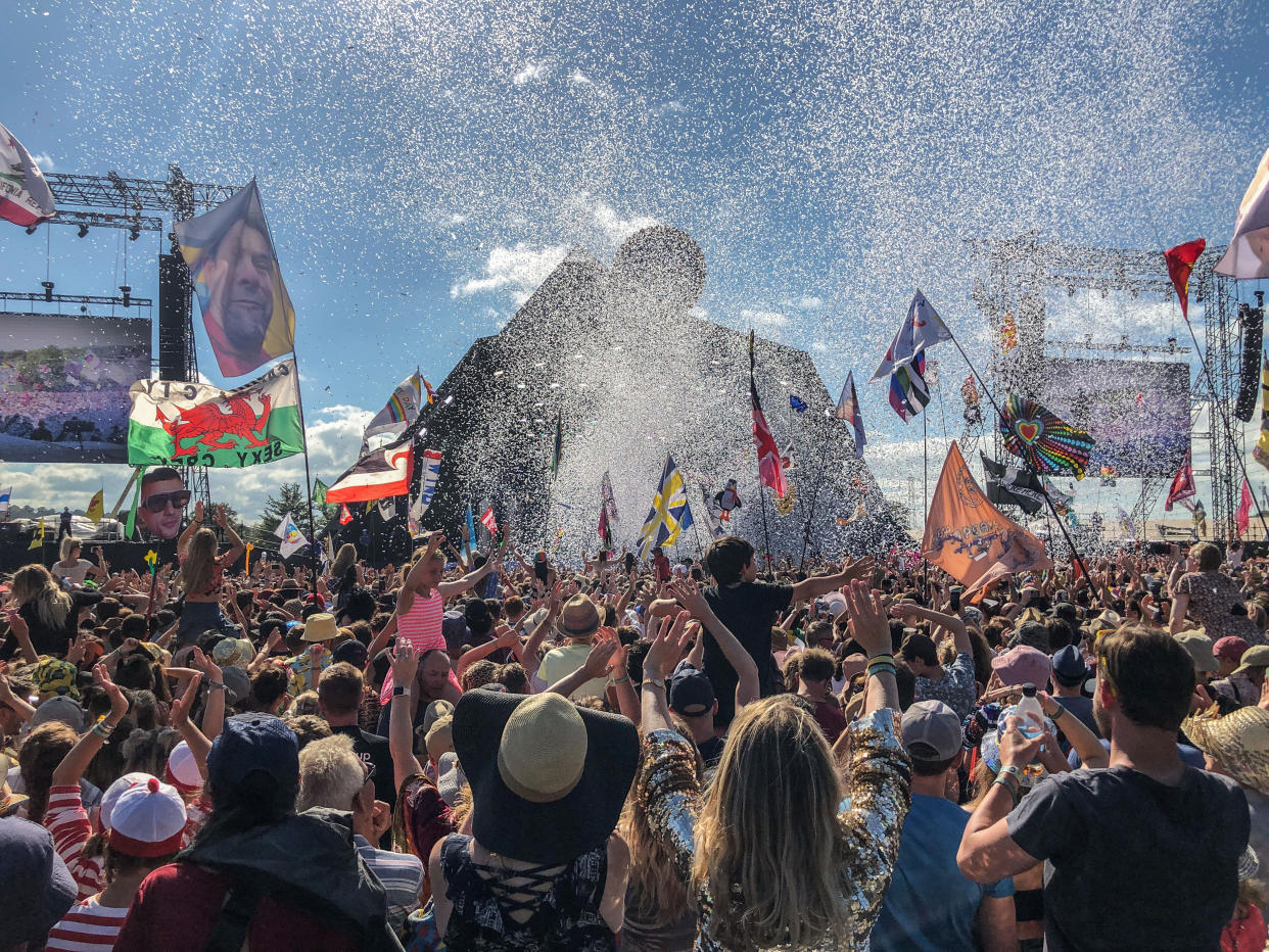 Crowds listen to Kylie perform on the Pyramid Stage at the 2019 Glastonbury Festival held at Worthy Farm, in Pilton, Somerset on June 30, 2019 near Glastonbury, England. The festival, founded in 1970, has grown into one of the largest outdoor green field festivals in the world. (Photo by Matt Cardy/Getty Images)