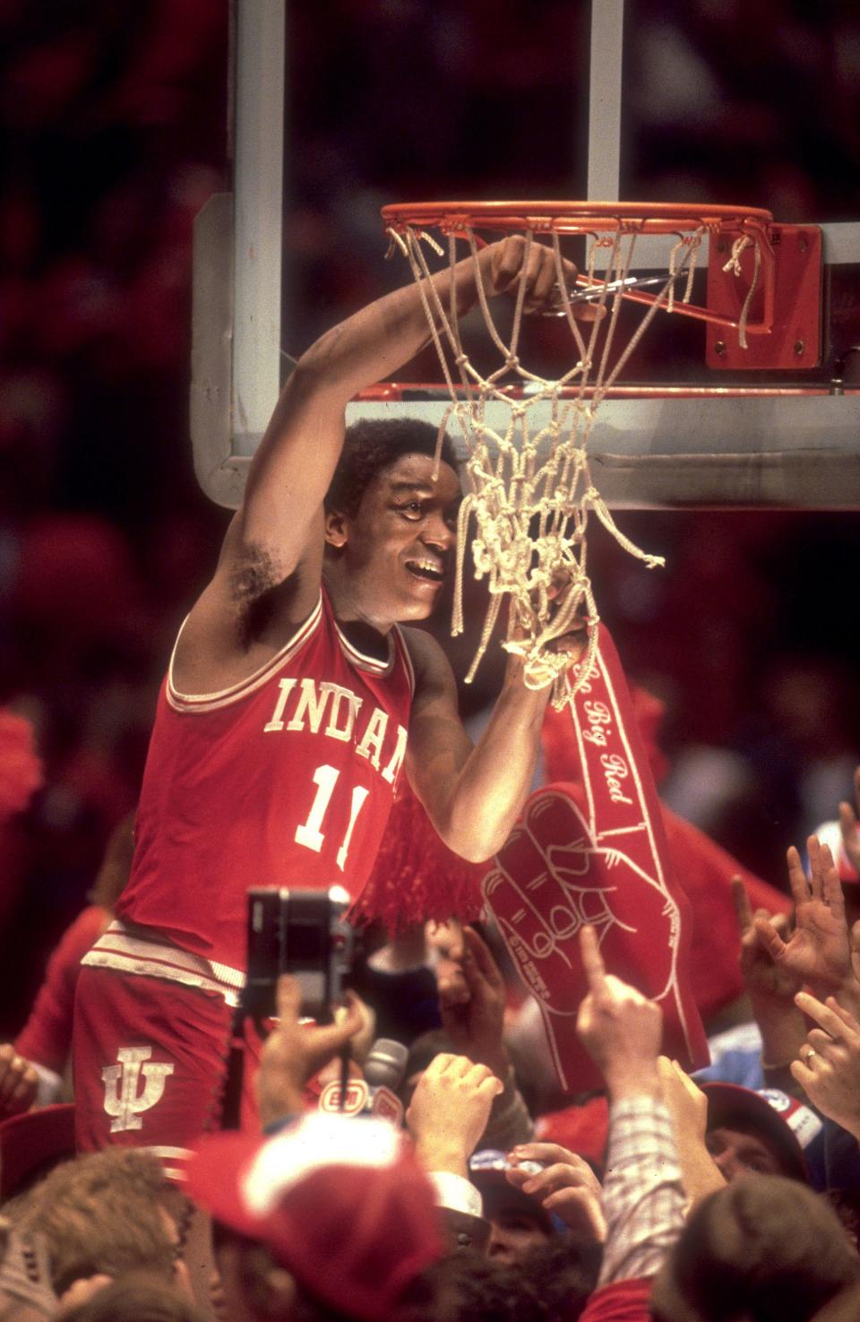 Indiana guard Isiah Thomas (11) cuts the net after winning the NCAA Men's National Basketball semifinal game held in Philadelphia PA at The Spectrum. Indiana defeated LSU 67-49 in March 1981.