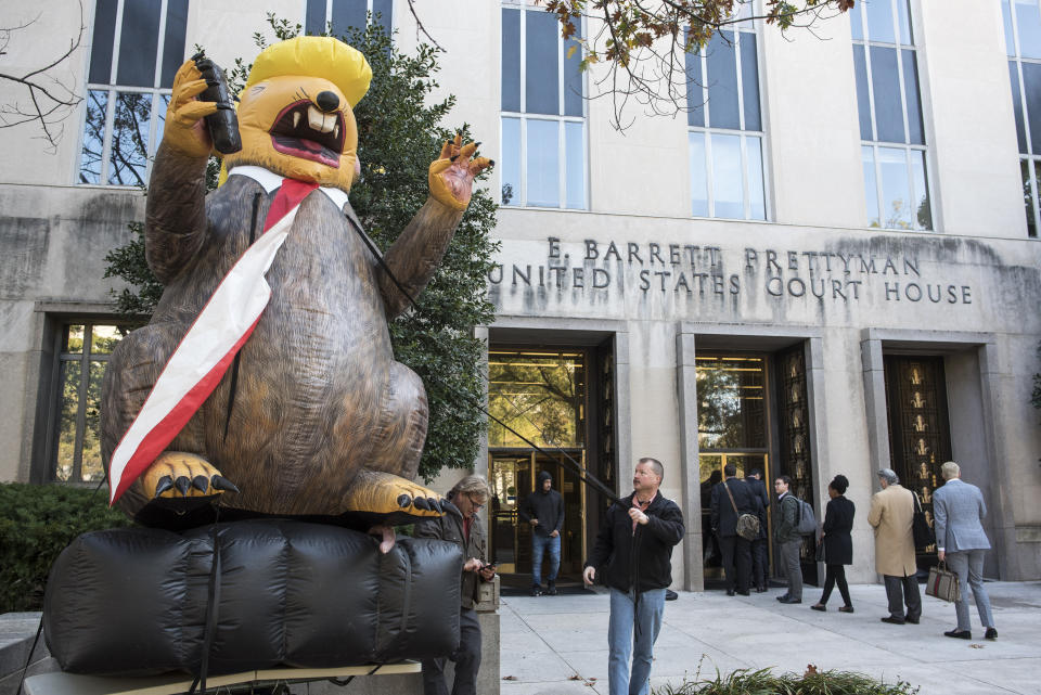 A "Trump Rat" is erected by the group Mad Dog Pac outside of the Federal Court where Roger Stone is appearing for the second day of jury selection for his federal trial, in Washington, Wednesday, Nov. 6, 2019. Stone, a longtime Republican provocateur and former confidant of President Donald Trump, goes on trial over charges related to his alleged efforts to exploit the Russian-hacked Hillary Clinton emails for political gain. (AP Photo/Cliff Owen)