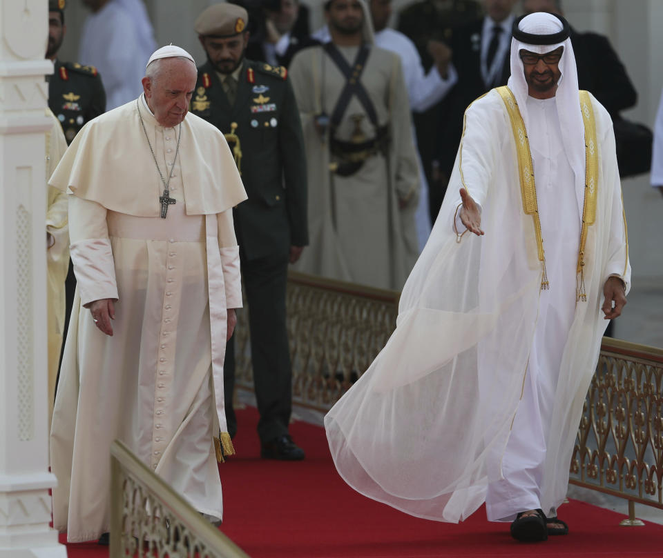 Pope Francis is welcomed by Abu Dhabi's Crown Prince and Deputy Supreme Commander of the UAE's Armed Forces, Sheikh Mohammed bin Zayed Al Nahyan, right, at the Abu Dhabi Presidential Palace, United Arab Emirates, Monday, Feb. 4, 2019. Francis travelled to Abu Dhabi to participate in a conference on inter religious dialogue sponsored the Emirates-based Muslim Council of Elders, an initiative that seeks to counter religious fanaticism by promoting a moderate brand of Islam. (AP Photo/Kamran Jebreili)
