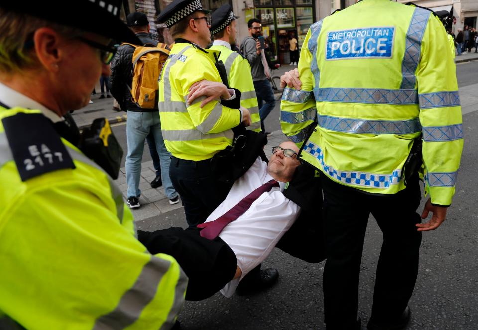 A protester is carried away from Oxford Circus (AP)