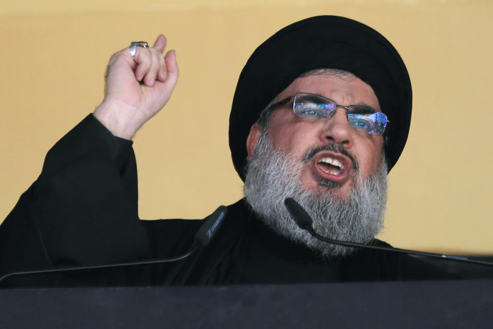 FILE - In this Oct. 24, 2015 file photo, Hezbollah leader Sheik Hassan Nasrallah addresses a crowd during the holy day of Ashoura, in a southern suburb of Beirut, Lebanon. On Monday, Oct. 18, 2021, Nasrallah revealed that his militant group has 100,000 trained fighters. (AP Photo/Hassan Ammar, File)
