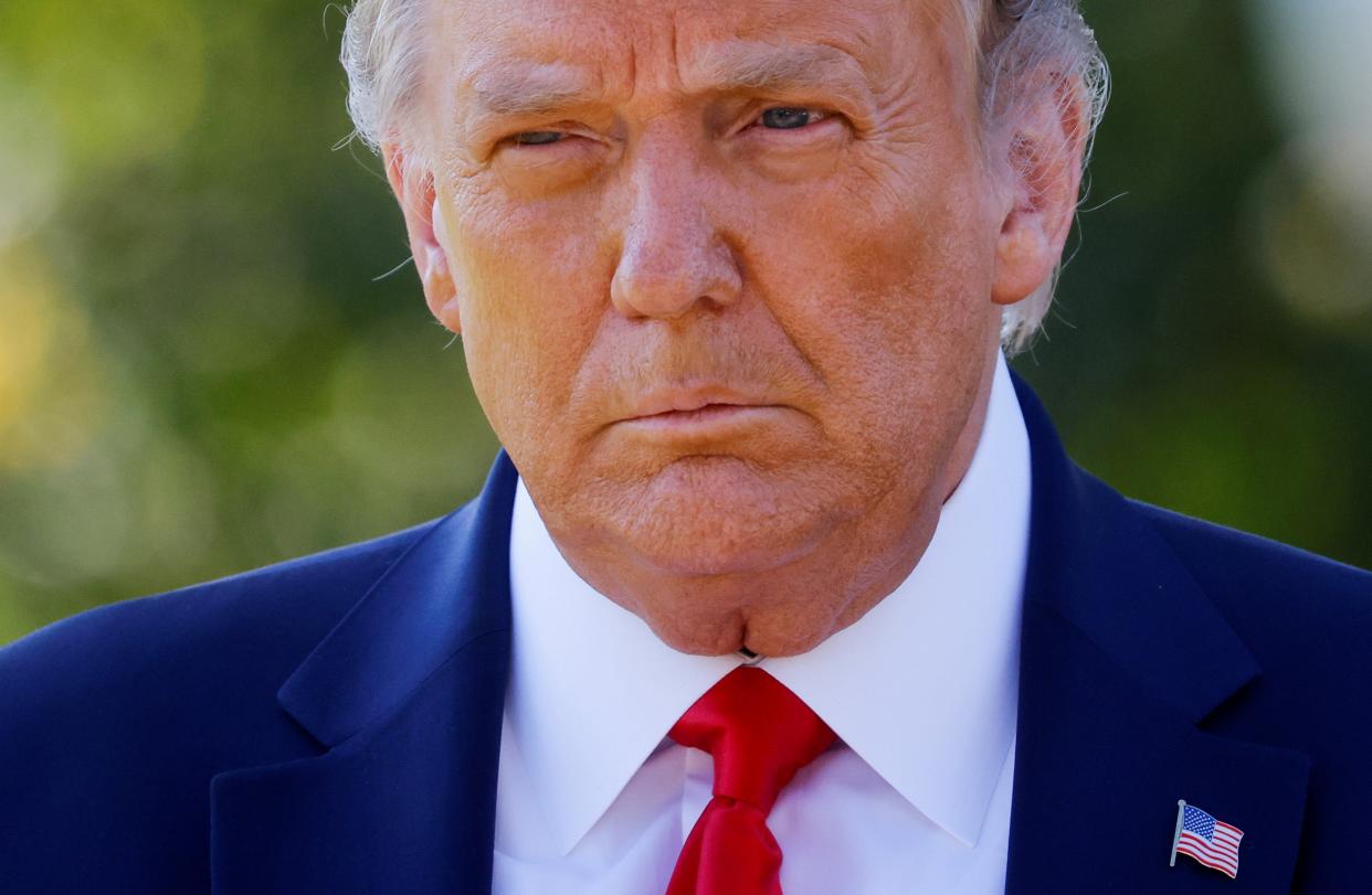 File image: Then-US President Donald Trump approaches reporters as he departs on campaign travel to Minnesota from the South Lawn at the White House in Washington, US, 30 September, 2020 (REUTERS)