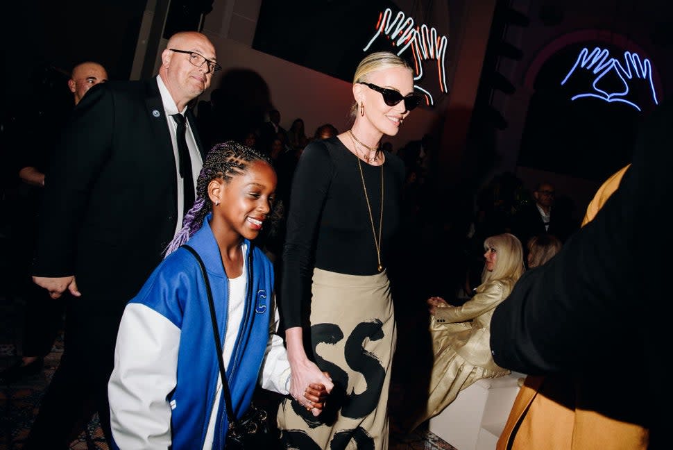 Charlize Theron and daughter August Theron at Dior Pre-Fall 2024 Show held at the Brooklyn Museum on April 15, 2024 in New York, New York.