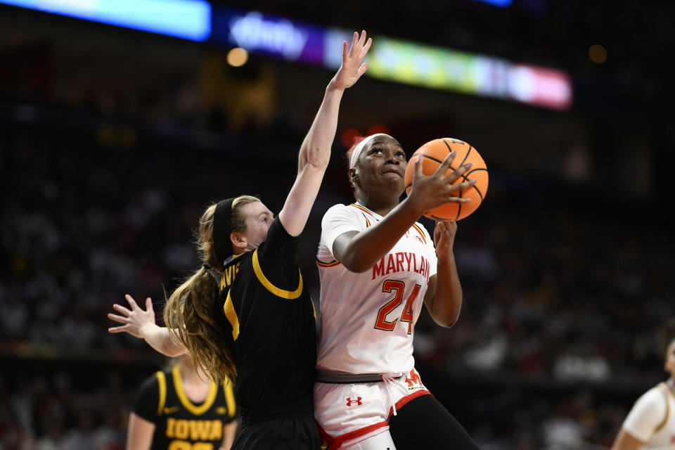 Maryland guard Bri McDaniel (24) goes to the basket against Iowa guard Molly Davis (1) during the second half of an NCAA college basketball game, Saturday, Feb. 3, 2024, in College Park, Md. (AP Photo/Nick Wass)