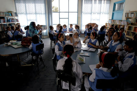 Students work in the library at the Islamabad College for girls in Islamabad, Pakistan, October 13, 2017. REUTERS/Caren Firouz