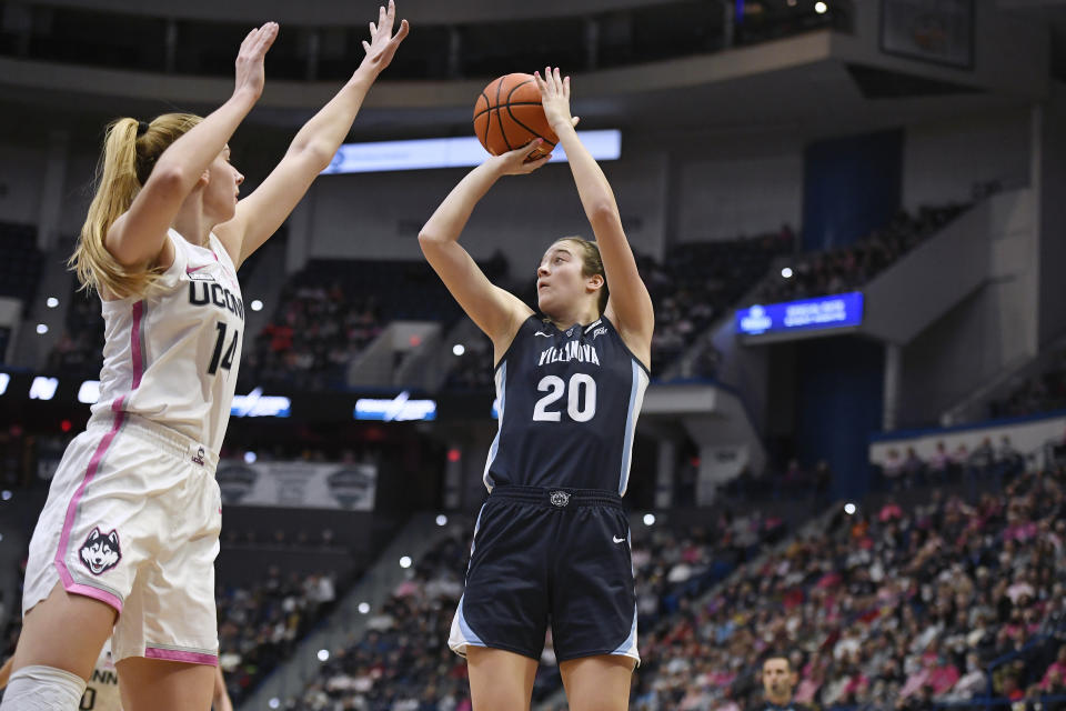 Villanova's Maddy Siegrist (20) shoots over UConn's Dorka Juhasz (14) in the first half of an NCAA college basketball game, Sunday, Jan. 29, 2023, in Hartford, Conn. (AP Photo/Jessica Hill)