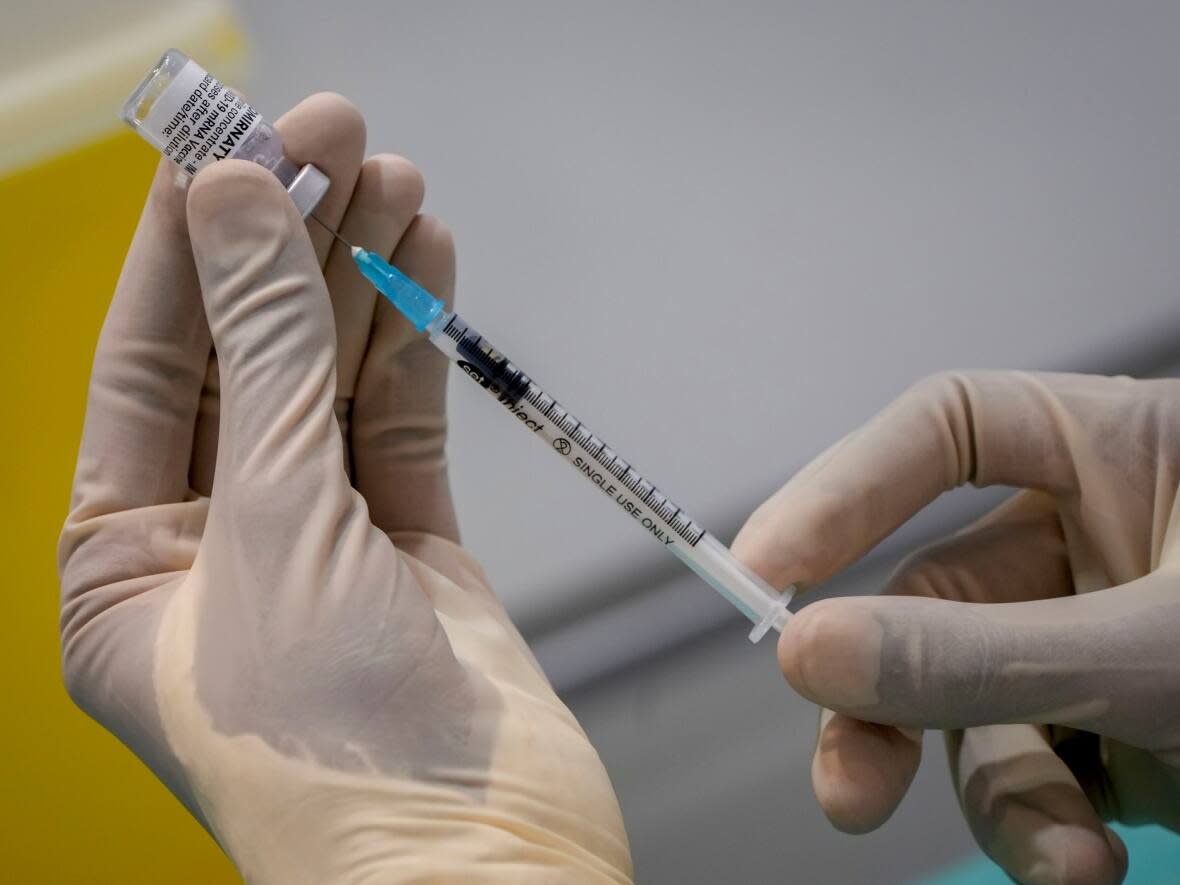 The Newfoundland and Labrador is getting rid of its vaccine mandate starting June 1, 2022. (Michael Probst/The Associated Press - image credit)