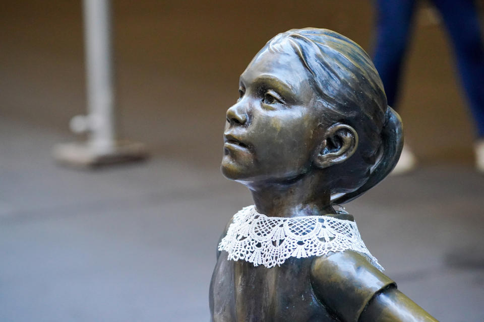 The Fearless Girl wearing a neck collar in remembrance of former Supreme Court Justice Ruth Bader Ginsburg. (Photo: Getty Images)