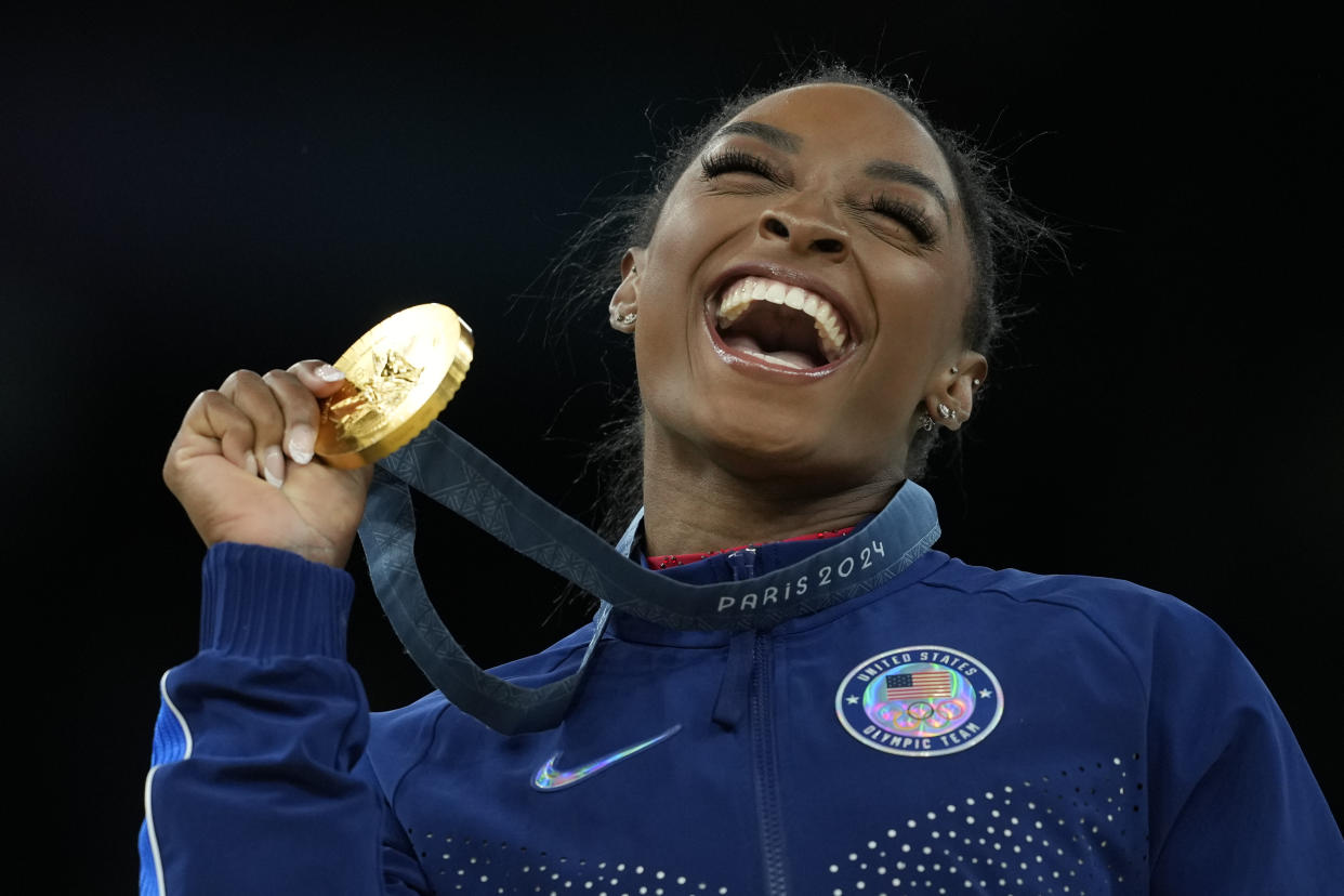 Simone Biles celebrates after winning the gold medal during the women's gymnastics finals at the Summer Olympics in Paris on Saturday.