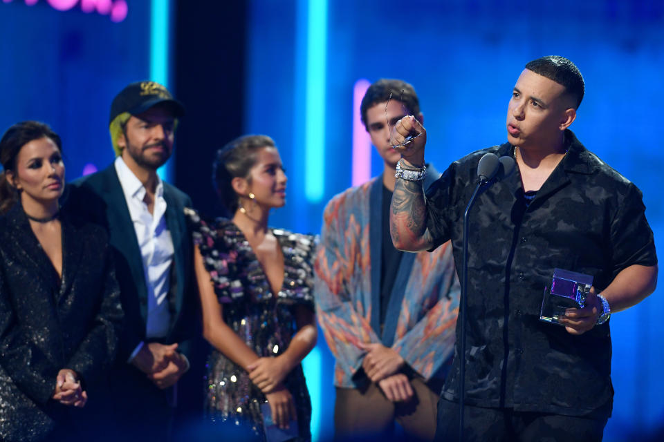 CORAL GABLES, FLORIDA - JULY 18:  Daddy Yankee accepts an award on stage during Premios Juventud 2019 at Watsco Center on July 18, 2019 in Coral Gables, Florida. (Photo by Jason Koerner/Getty Images)