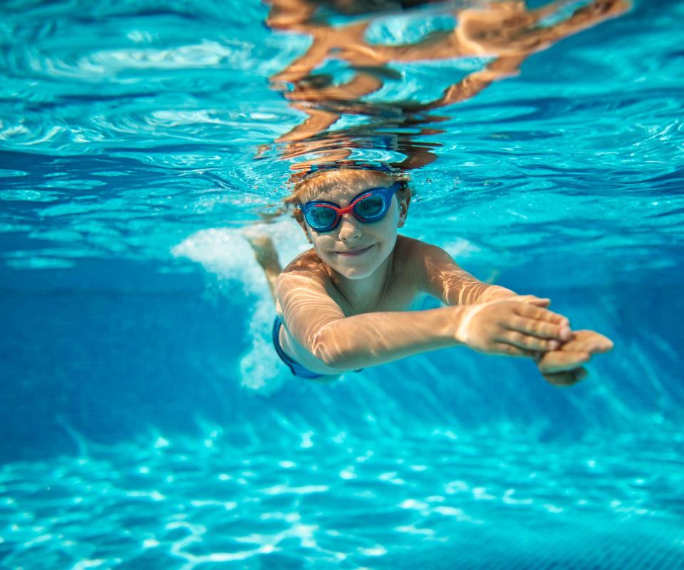 boy swimming underwater