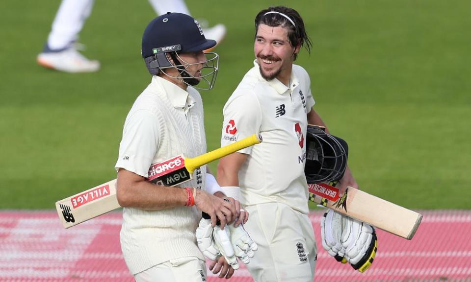 Joe Root and Rory Burns walk off having accelerated the England innings