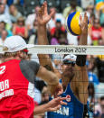 Canada's Martin Reader misses a block during preliminary beach volleyball action against Tarjei Viken Skarlund and Martin Spinnangr at the 2012 London Olympics, on July 30, 2012. Reader and his partner Joshua Binstock lost two sets to none. COC Photo: Jason Ransom