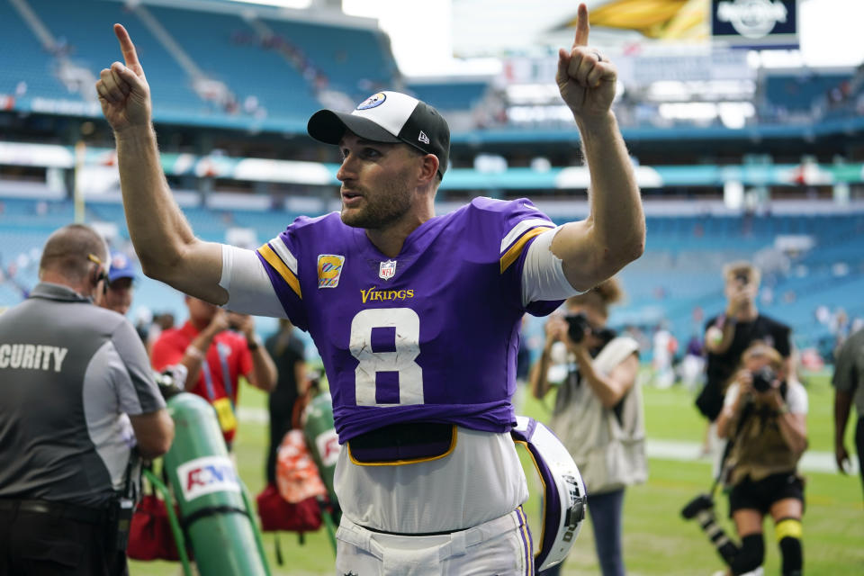 Minnesota Vikings quarterback Kirk Cousins (8) celebrates the Vikings' victory over the Miami Dolphins, at the end of an NFL football game, Sunday, Oct. 16, 2022, in Miami Gardens, Fla. (AP Photo/Lynne Sladky)