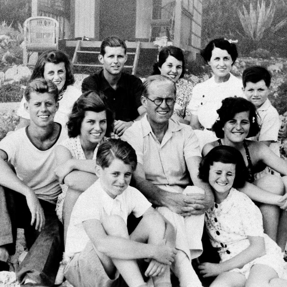 Joseph P. Kennedy, Sr. with his family. Clockwise, from bottom left: Robert, Eunice, John, Kathleen, Joe Jr., Rosemary, wife Rose, Teddy, Patricia and Jean. (Photo: Associated Press)