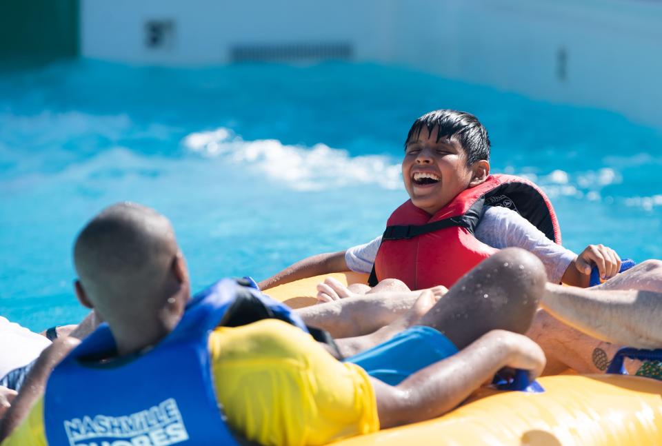 Luis Guadarrama, 13, reacts after going down a waterslide at Nashville Shores in Nashville, Tenn., Thursday, June 20, 2024.