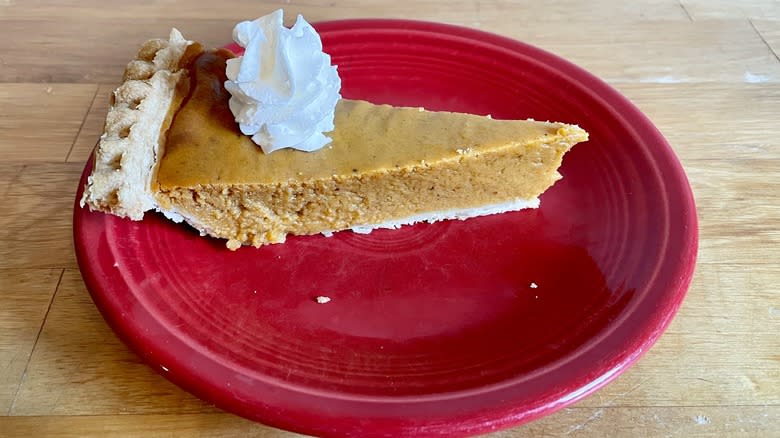 Pumpkin pie with whipped cream on top