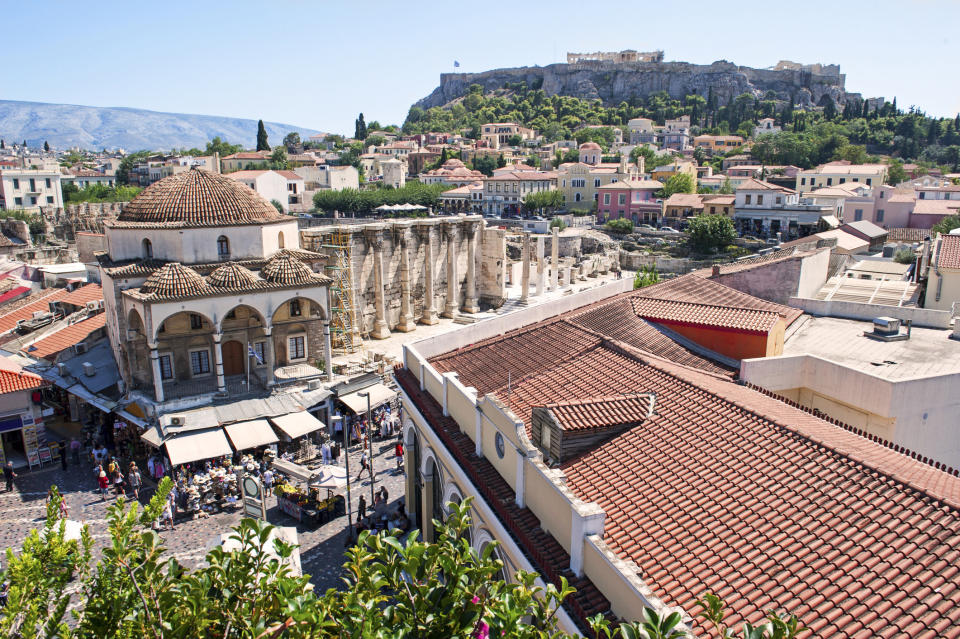 A busy square with the Acropolis in the background
