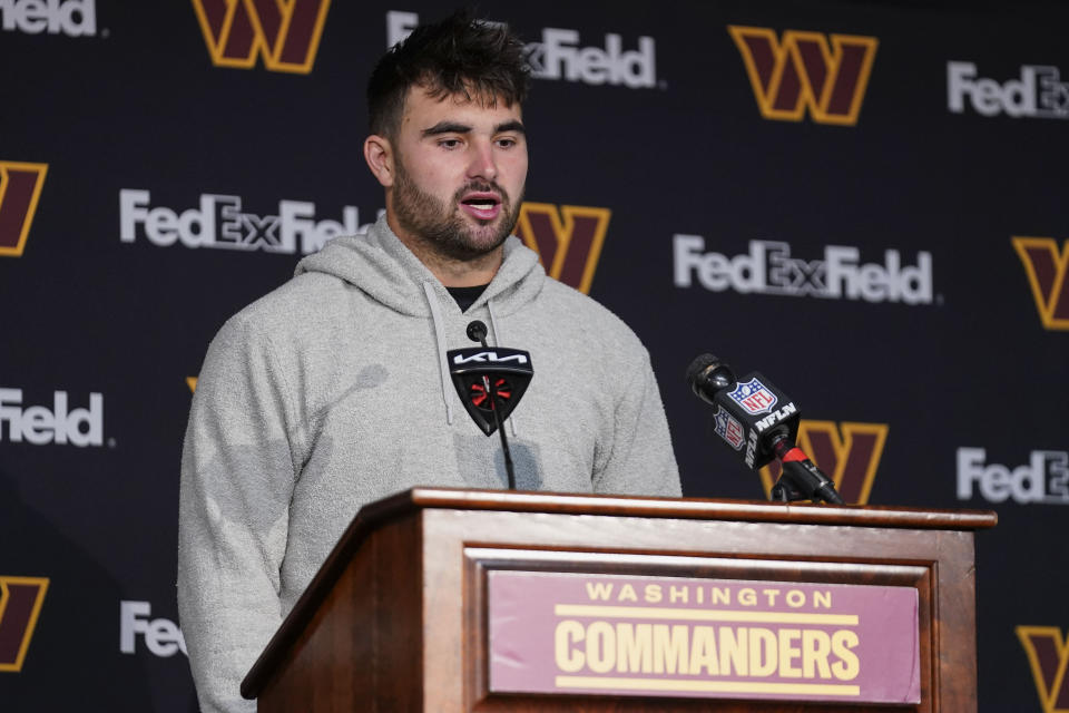 Washington Commanders quarterback Sam Howell (14) speaks to members of the media end of an NFL football game against the Philadelphia Eagles, Sunday, Oct. 29, 2023, in Landover, Md. Eagles won 38-31. (AP Photo/Stephanie Scarbrough)