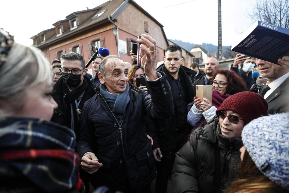 Eric Zemmour, far right candidate for the French presidential election 2022, gestures as he visits a vineyard and meets local supporters in Husseren-les-chateaux, eastern France, Saturday, Dec. 18, 2021. The first round of the 2022 French presidential election will be held on April 10, 2022 and the second round on April 24, 2022. (AP Photo/Jean-Francois Badias)