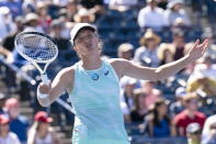 Iga Swiatek reacts during her defeat to Beatriz Haddad Maia in National Bank Open tennis action in Toronto, Thursday, August 11, 2022. (Chris Young//The Canadian Press via AP)