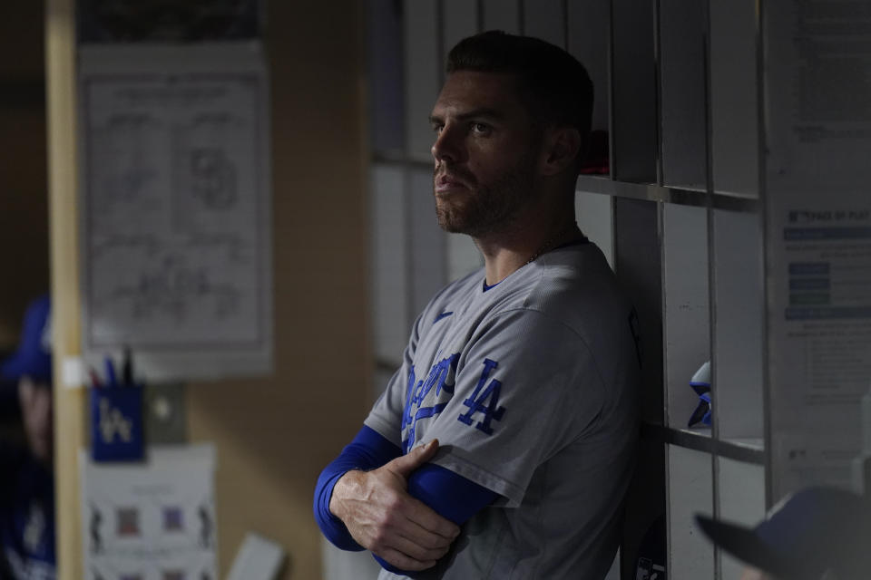 Los Angeles Dodgers first baseman Freddie Freeman looks on from the dugout during the eighth inning in Game 4 of a baseball NL Division Series against the San Diego Padres, Saturday, Oct. 15, 2022, in San Diego. (AP Photo/Jae C. Hong)