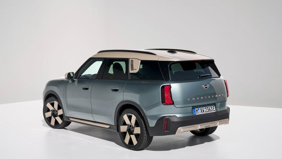 2025 mini cooper countryman electric in light blue with a cream and black interior