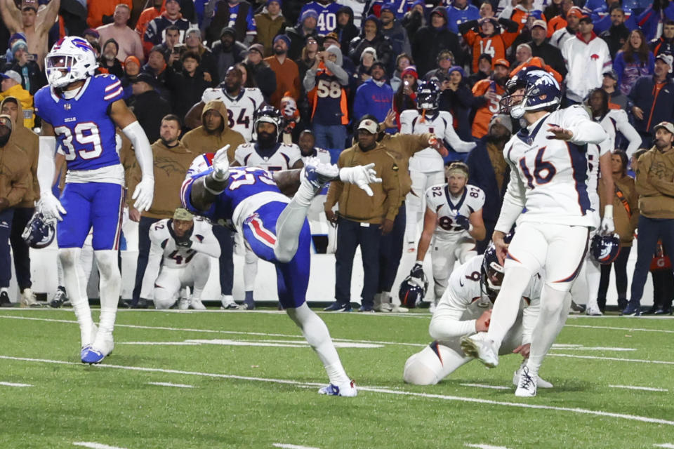 Denver Broncos place kicker Wil Lutz, right, looks after the winning field goal during the second half of an NFL football game against the Buffalo Bills, Monday, Nov. 13, 2023, in Orchard Park, N.Y. (AP Photo/Jeffrey T. Barnes)