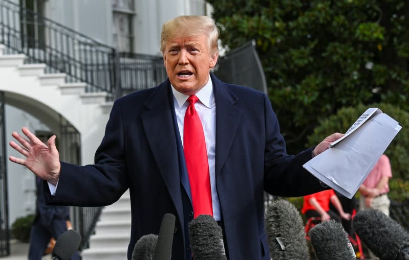 U.S. President Trump speaks to reporters as he departs for travel to Texas at the White House in Washington