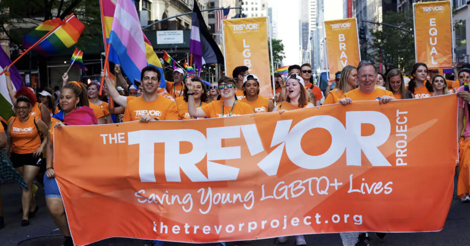 Trevor Project volunteers march in New York City's Pride parade.