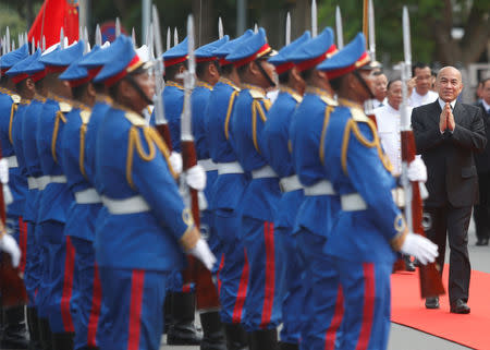 Cambodia's King Norodom Sihamoni (R), inspects an honor guard as he attends the first plenary parliament session at the National Assembly in Phnom Penh, Cambodia September 5, 2018. REUTERS/Samrang Pring