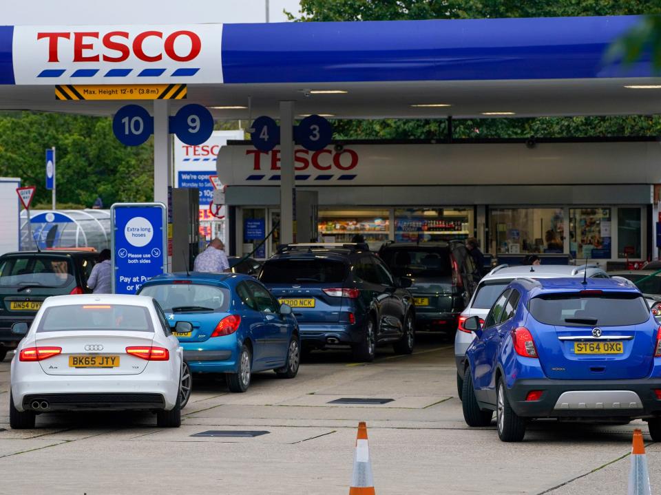 Motorists queue for fuel at a Tesco petrol station in Bracknell (PA)