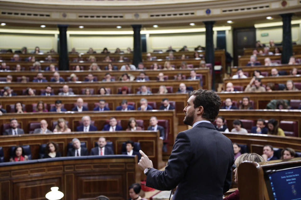 The leader of the conservative Popular party, Pablo Casado speaks at the Spanish Parliament in Madrid, Spain, Sunday, Jan. 5, 2020. Spain's interim Prime Minister Pedro Sanchez is facing the first of two opportunities Sunday to win the endorsement of the Spanish Parliament to form a left-wing coalition government. It would be Spain's first coalition government since the return of democracy following the death of dictator Francisco Franco in 1975. (AP Photo/Manu Fernandez)