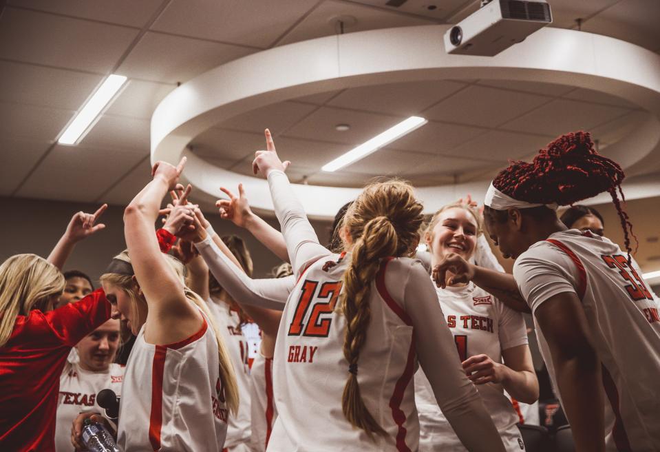 The Texas Tech women's basketball team celebrates in the locker room following a win over Kansas State on Saturday, Jan. 15, 2022, at United Supermarkets Arena in Lubbock.