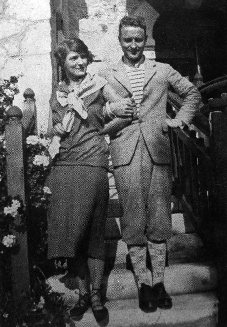 F. Scott Fitzgerald and his wife, Zelda Sayre, link arms in 1926.