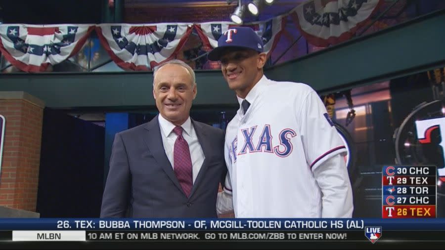 Bubba Thompson stands with the commissioner of Major League Baseball after being selected in the 2017 MLB Draft.