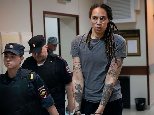 PHOTO: FILE - WNBA star and two-time Olympic gold medalist Brittney Griner is escorted from a courtroom after a hearing in Khimki just outside Moscow, Russia, on Aug. 4, 2022.  (AP Photo/Alexander Zemlianichenko)