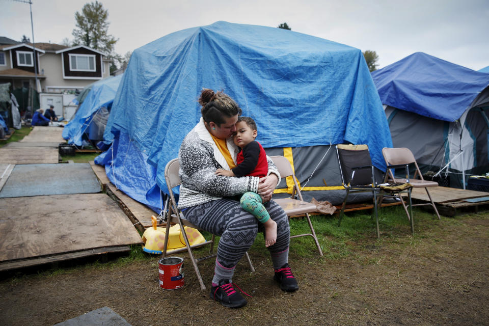 Kadee Ingram, 28, holds her son Sean, 2, at SHARE/WHEEL Tent City 3 outside Seattle. The Employee Hours Tax would have provided just under $50 million in funding to fight homelessness. (Photo: Shannon Stapleton/Reuters)