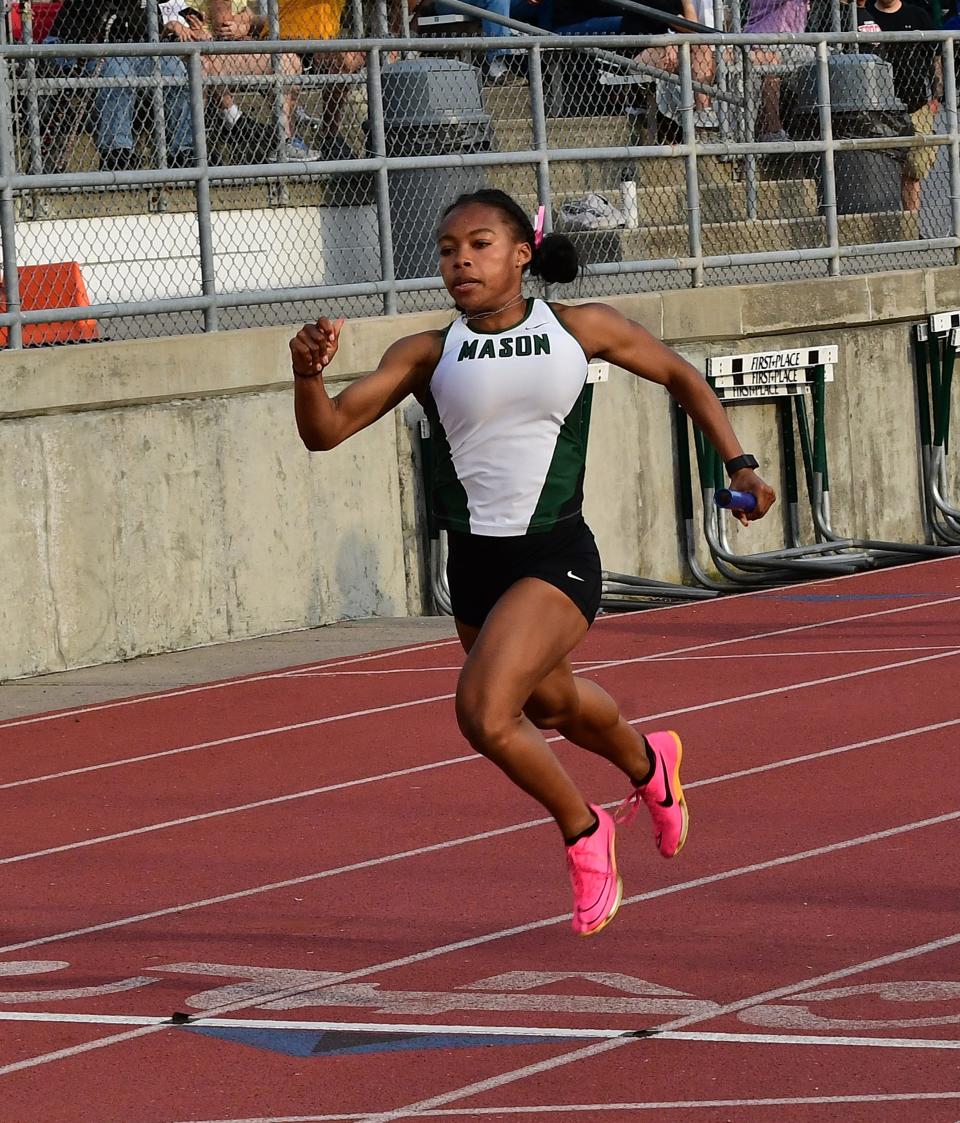 Mason's Abby Love, shown running in the district meet, won a regional title in the 100-meter dash.