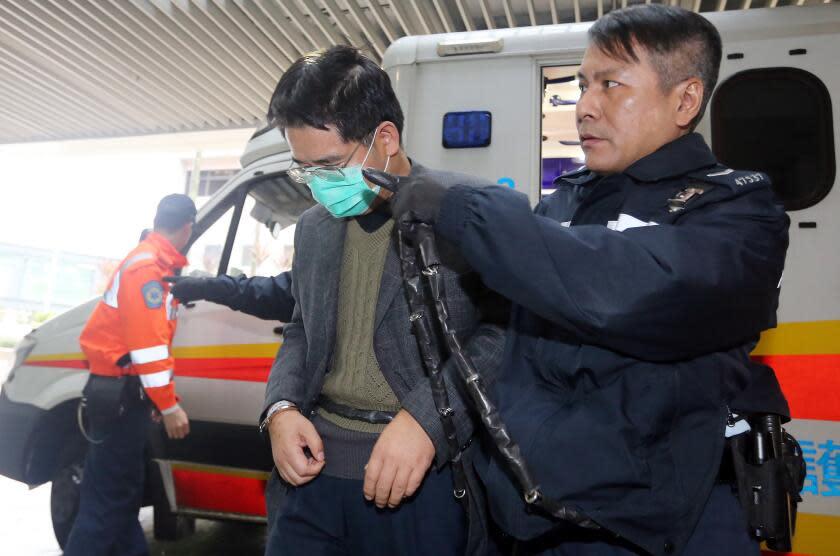 Double-murder suspect Shi Deyun, 44, being sent to Pamela Youde Nethersole Eastern Hospital in Chai Wan in the morning. 01FEB16 SCMP/ David Wong (Photo by David Wong/South China Morning Post via Getty Images)