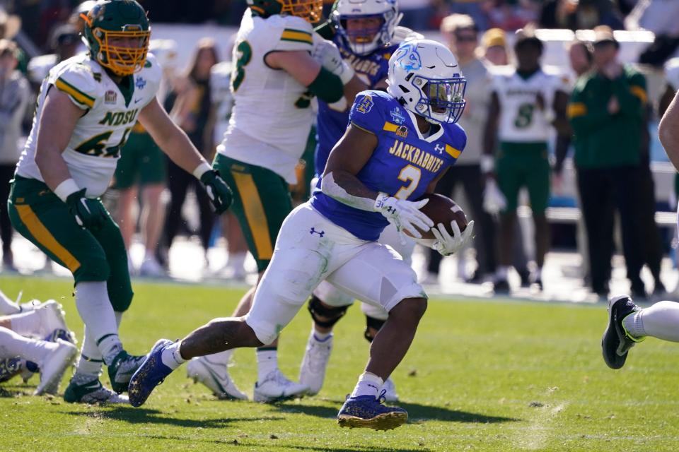 South Dakota State running back Amar Johnson (3) finds room to run on his way to scoring a touchdown during the first half of the FCS Championship NCAA college football game against the North Dakota, Sunday, Jan. 8, 2023, in Frisco, Texas. (AP Photo/LM Otero)
