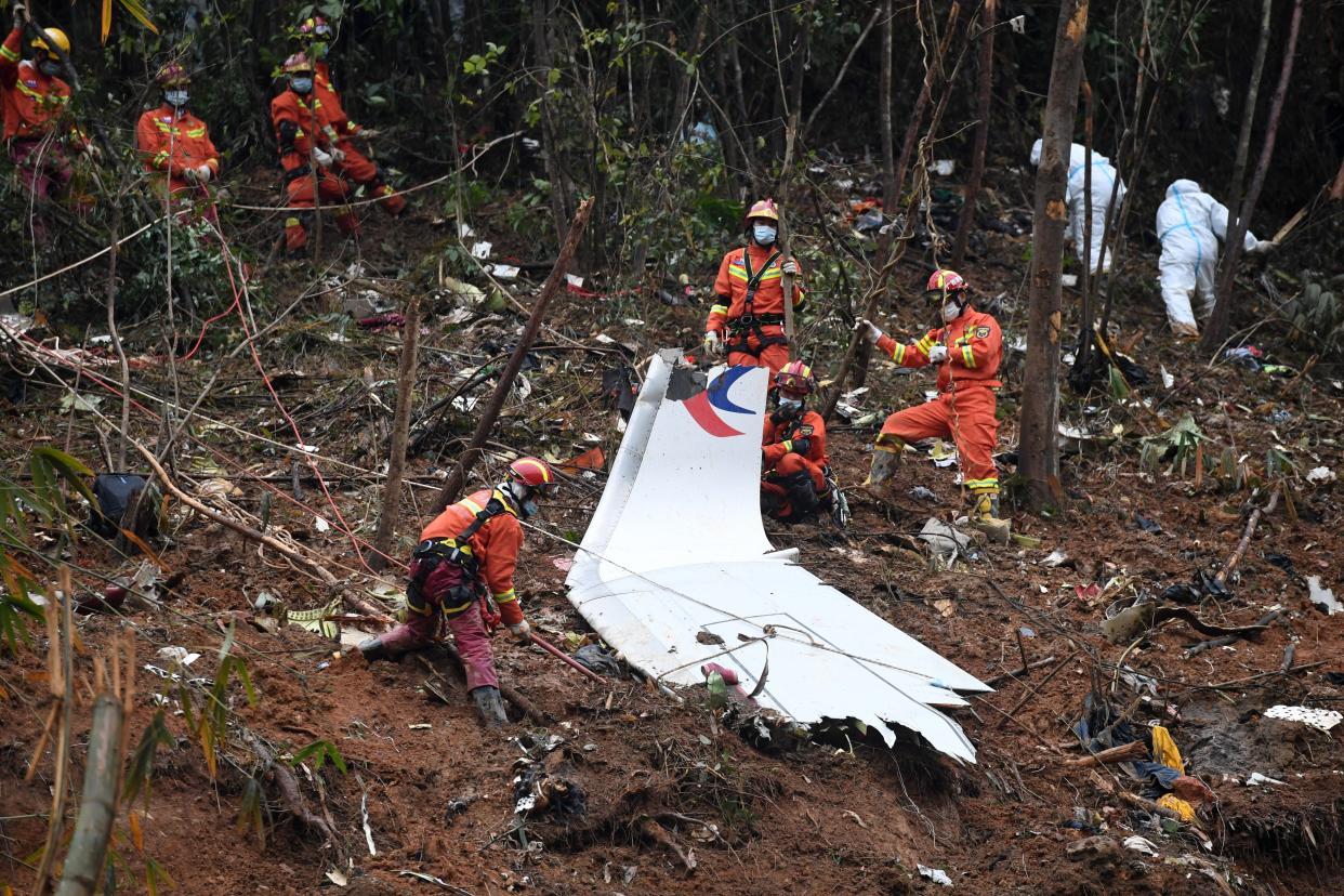 Rescuers conduct search and rescue work at a plane crash site in Tengxian County, south China's Guangxi Zhuang Autonomous Region, March 24, 2022.