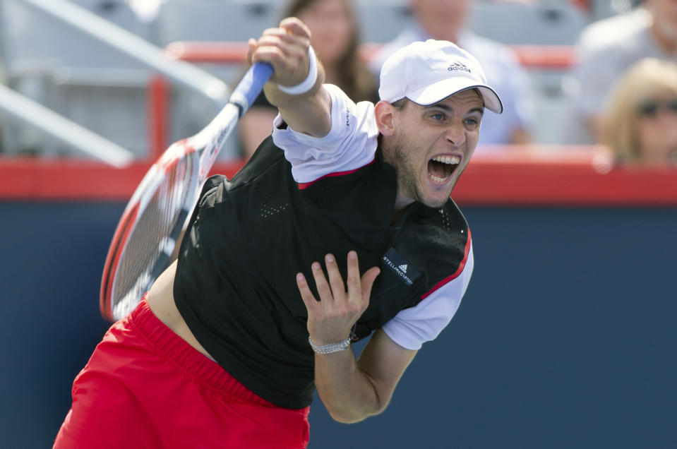 Dominic Thiem of Austria serves to Marin Cilic of Croatia during the Rogers Cup men’s tennis tournament Thursday, Aug. 8, 2019, in Montreal. (Paul Chiasson/The Canadian Press via AP)