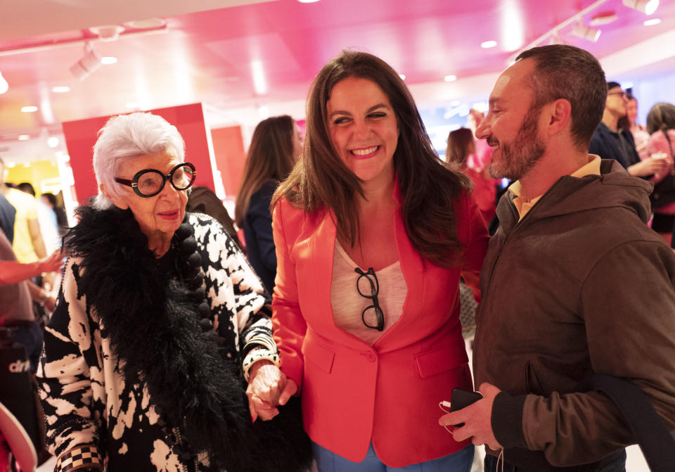 Rachel Shechtman, center, founder of Story, leads model Iris Apfel through her store on its opening day at Macy's, Wednesday, April 10, 2019, in New York. Macy's bought Story a year ago and Shechtman came on board as its brand experience officer. (AP Photo/Mark Lennihan)