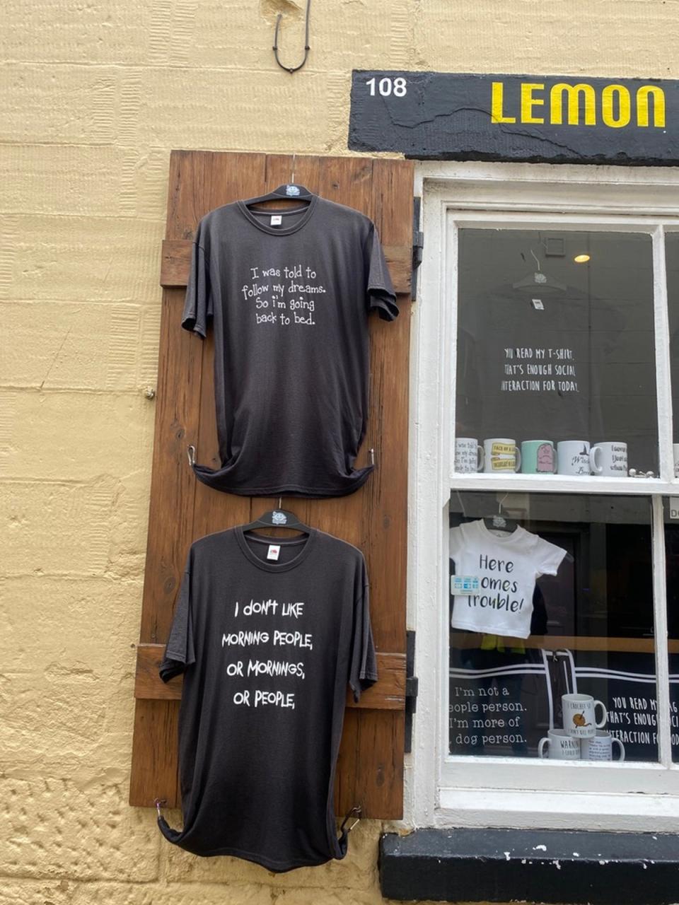 T-shirts hanging in a Whitby shop (Maya Oppenheim)