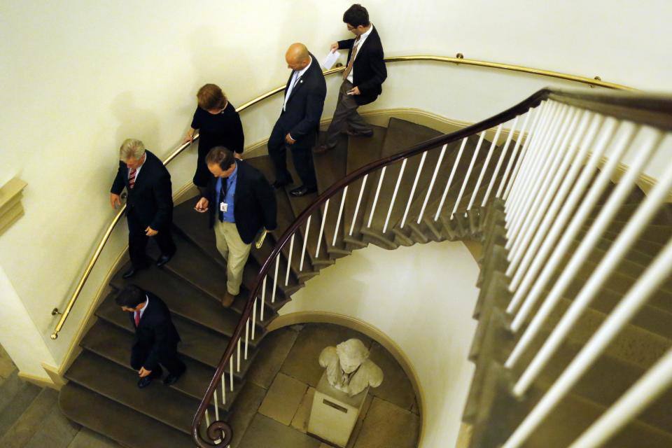 U.S. House Majority Whip Kevin McCarthy (R-CA) (L, with striped red tie) is trailed by reporters as he returns to his office at the U.S. Capitol in Washington September 30, 2013, after the Republican-led U.S. House of Representatives late on Monday approved another emergency funding bill that the Democratic-led Senate is certain to reject, moving the government closer to a Tuesday shutdown. The House passed the measure and sent it to the Senate where new Obamacare provisions included in the bill are expected to be killed. REUTERS/Jonathan Ernst (UNITED STATES - Tags: POLITICS BUSINESS HEALTH)