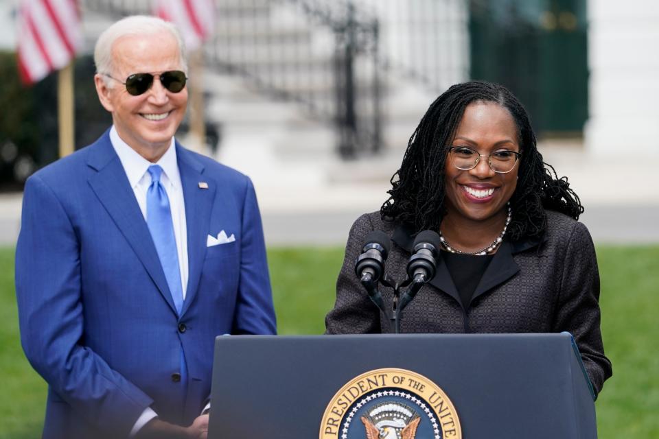 President Joe Biden listens as Judge Ketanji Brown Jackson speaks during an event on the South Lawn of the White House in Washington, Friday, April 8, 2022, celebrating the confirmation of Jackson as the first Black woman to reach the Supreme Court. (AP Photo/Andrew Harnik)