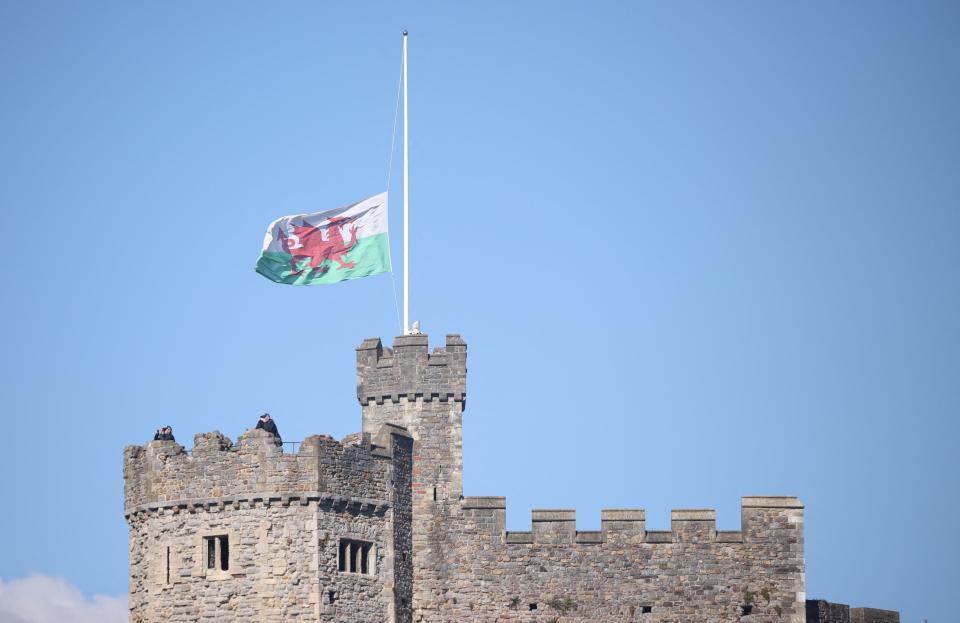 A Welsh flag flies at half mast at Cardiff Castle, following the death of Britain's Queen Elizabeth, (REUTERS)